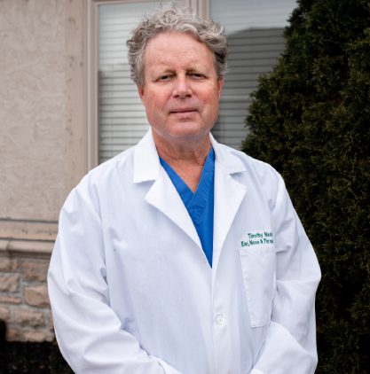 Dr. Nash wearing a lab coat